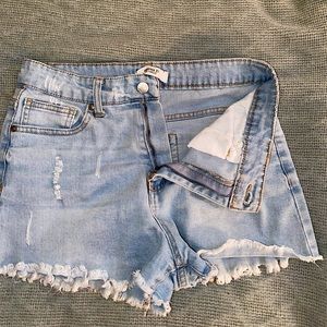 Distressed light denim shorts